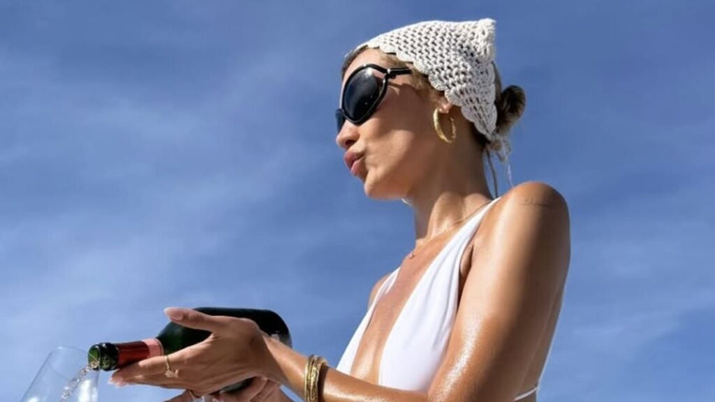 Bella Hadid puts on VERY cheeky display in plunging one-piece swimsuit… after death-defying yacht stunt that shocked her pals