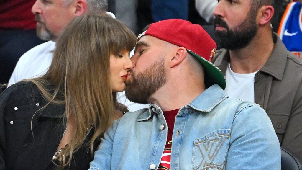 Taylor Swift turns heads in a £16,000 designer look as she packs on the PDA with Travis Kelce at a Knicks game