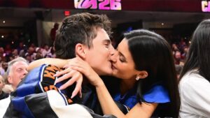 Kylie Jenner and Timothee Chalamet share a passionate kiss while cheering the Knicks to victory