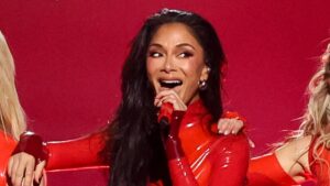 The Pussycat Dolls enjoy a red hot reunion in matching latex looks as they lead 2026 American Music Awards performances with Karol G