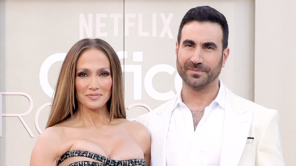 Jennifer Lopez’s face says it all as Office Romance co-star Brett Goldstein performs gentlemanly move at premiere