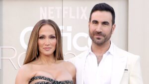 Jennifer Lopez’s face says it all as Office Romance co-star Brett Goldstein performs gentlemanly move at premiere