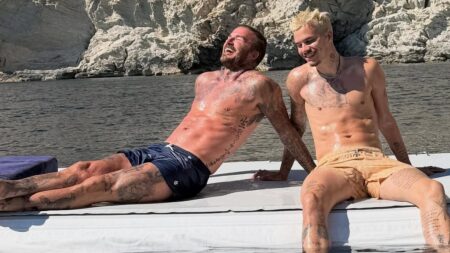 David Beckham and Romeo show off their toned physiques as they sunbathe in the Med as Victoria shares sweet snaps from family holiday