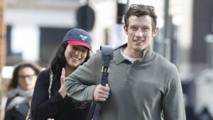 Dua Lipa and Callum Turner can’t stop smiling as they arrive at Luton Airport to fly on a private jet to Sicily ahead of their lavish Italian nuptials