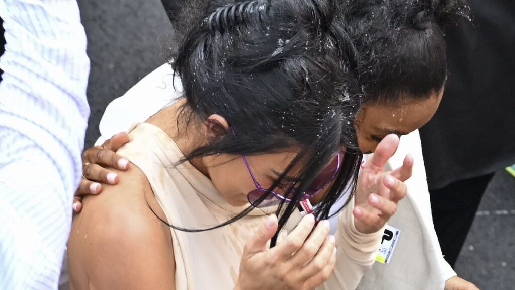 Lewis Hamilton blows a kiss to Kim Kardashian and playfully sprays her with champagne while celebrating at the Monaco Grand Prix – as ‘rude’ star is slammed for snubbing legendary F1 reporter