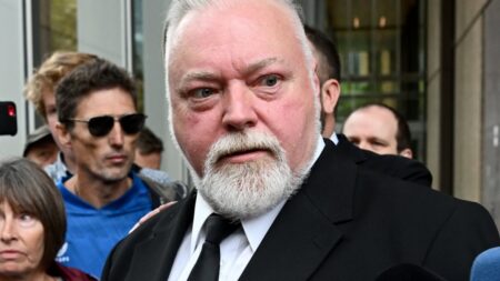 Kyle Sandilands considers settlement amid concerns over drawn‑out court case and reports he is already working on a new show
