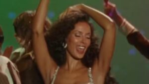 Maya Jama shows ex Ruben Dias what he’s missing in a dazzling silver gown as she is promoted to ‘popstar’ status in Blossoms new music video Meet Me In Love