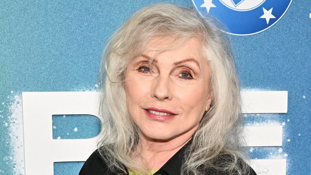 Debbie Harry is still a blonde bombshell at 80 as she reunites with Blondie ex at Supergirl premiere