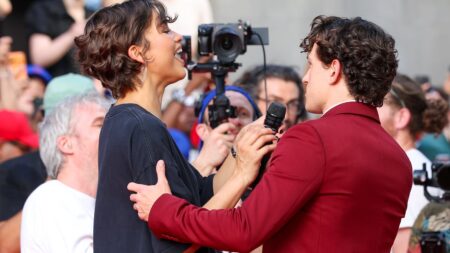Zendaya shows off her toned legs in a graphic print T-shirt as she shares sweet moment with husband Tom Holland at Paris Spider-Man screening