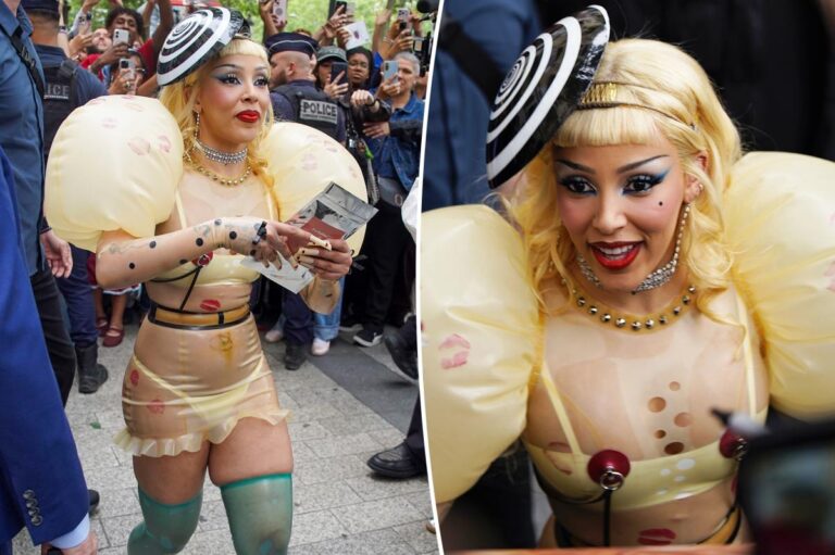 Doja Cat’s sheer latex look has faux piercings, inflated sleeves and lipstick kisses