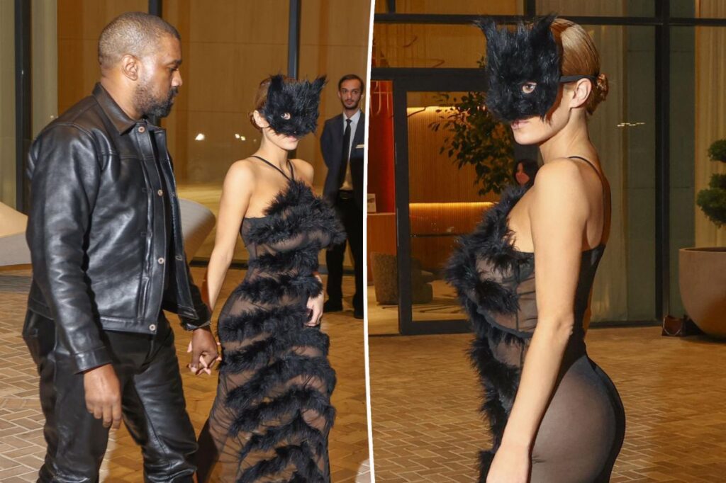 Bianca Censori gets frisky in a cat face mask with sheer dress — and nothing underneath