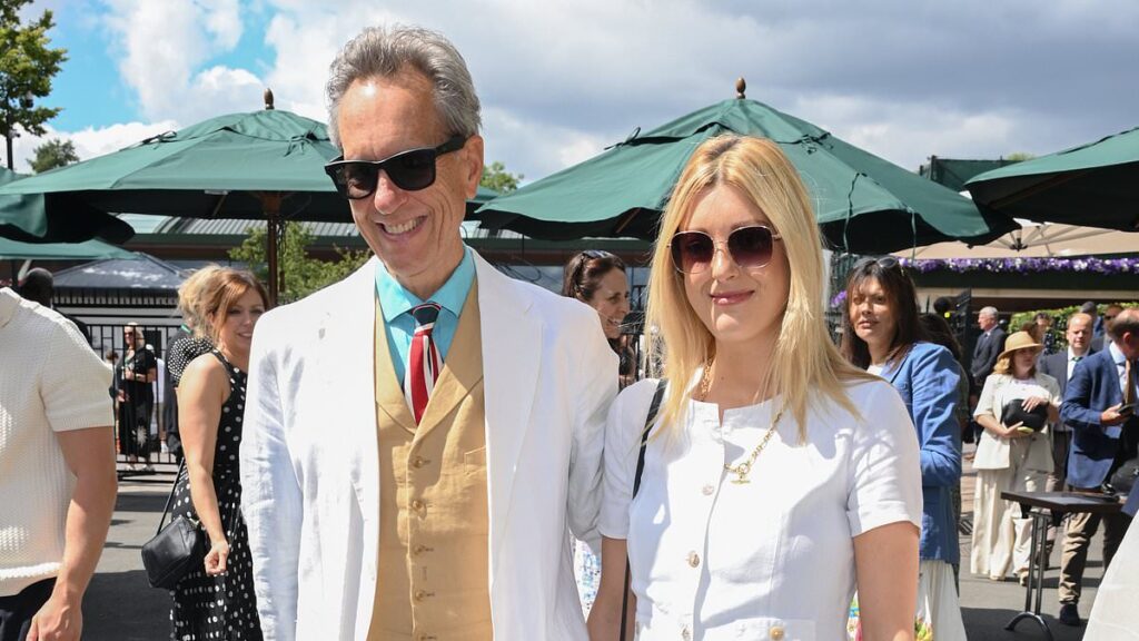Proud new grandfather Richard E. Grant looks dapper in tennis whites as he treats daughter Olivia, 37, to her first post-baby day out on day three of Wimbledon