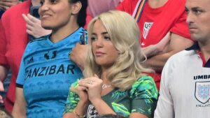 Jude Bellingham’s girlfriend Ashlyn and Jordan Pickford’s wife Megan bite their nails as England face tense second half while Harry Kane’s wife Kate rallies team with sweet banner