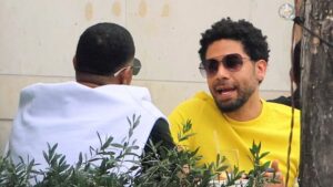 Hate crime hoaxer Jussie Smollett refuses to confirm he’s official with Karamo Brown… after passionately smooching Queer Eye star at airport