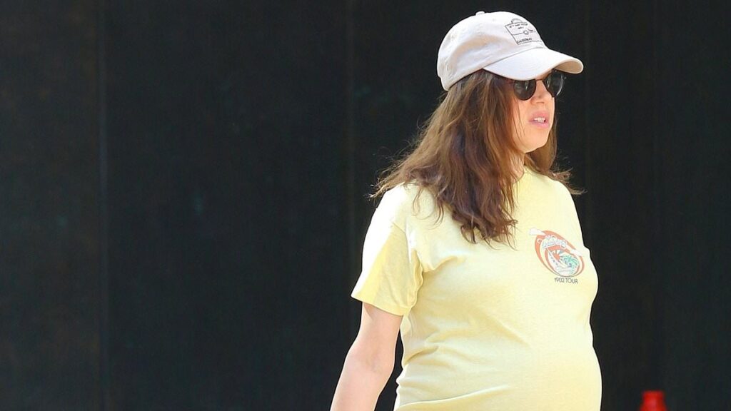Aubrey Plaza, 42, parades her huge baby bump while walking her dog in sweltering NYC