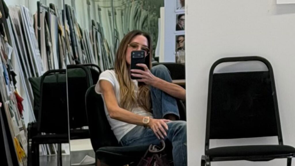 Victoria Beckham looks unbothered as she snaps a selfie in her studio after Katie Price reignited their feud