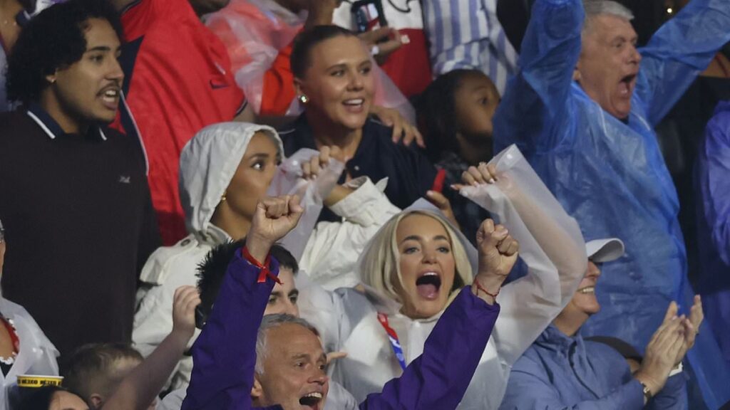 Kate Kane and Megan Pickford celebrate in the stands as their Three Lions husbands beat Mexico