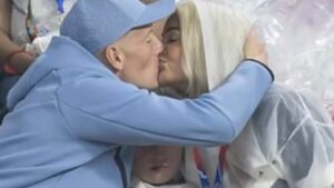 Megan Pickford says ‘sorry’ to son Arlo, 7, for being stuck in the middle of her passionate kiss with England star goalie Jordan to celebrate his ‘magic’ World Cup performance