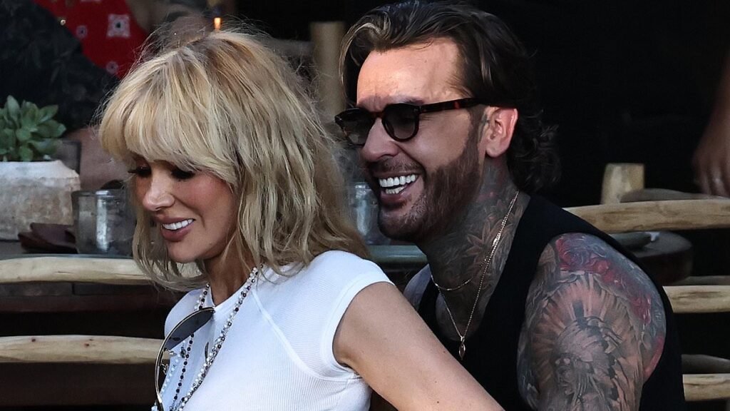 Olivia Attwood passionately kisses Pete Wicks before he carries her designer bag for dinner date in Ibiza