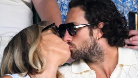 Aaron Taylor-Johnson, 36, and wife Sam, 59, share a passionate kiss as they make a rare appearance with their giggling daughters on day nine of Wimbledon