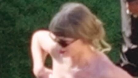 Taylor Swift suffers wardrobe malfunction as she wrestles pink gown at ex-Chiefs star’s wedding… as fans hit out at long wait for pictures of her OWN dress
