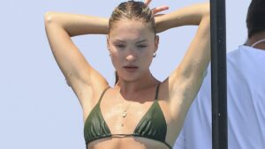 Lila Moss turns heads as she shows off her toned frame in a skimpy green bikini while on a luxury yacht with her friends in Ibiza