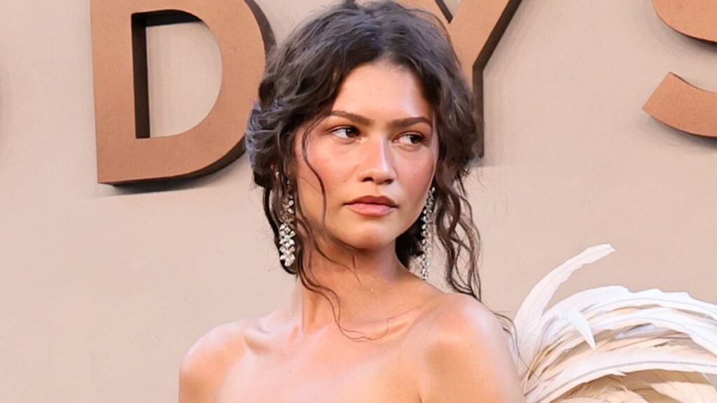 Zendaya looks angelic in a daring white gown with wings alongside pregnant Anne Hathaway and Lupita Nyong’o as they lead the star-studded premiere of The Odyssey in New York
