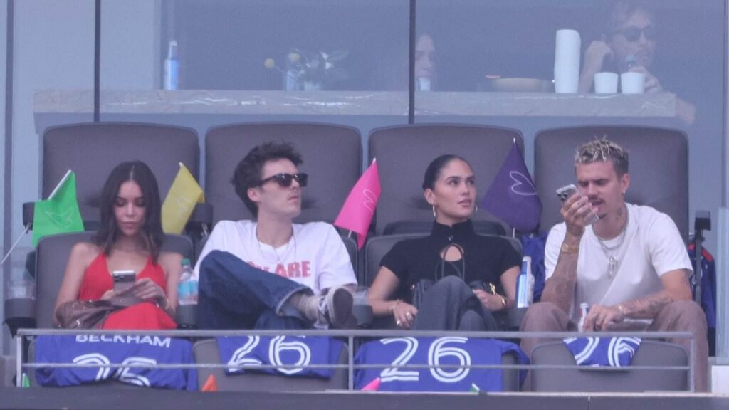 Romeo and Cruz Beckham are joined by their girlfriends Kim Turnbull and Jackie Apostel as they arrive at the World Cup final