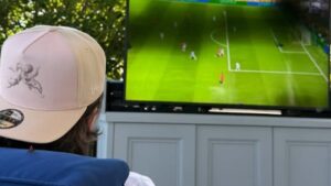 Brooklyn Beckham watches the World Cup final from his sofa at home as his entire family support from the MetLife Stadium – after savage Door Dash ad