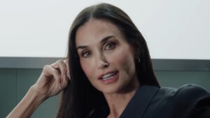 Demi Moore’s taut face at 63 steals the spotlight from KATSEYE as she stars in first new music video in 30 YEARS