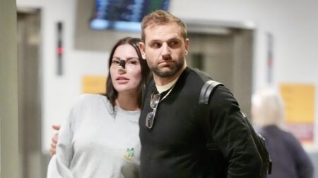 Married At First Sight groom Scott McCristal plays the doting boyfriend as he returns from Turkey with Brienna Stockdale following her nose job