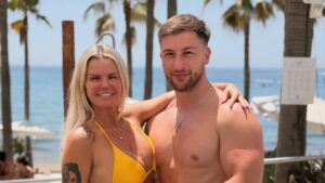 Bikini-clad Kerry Katona, 45, packs on the PDA with her toyboy boyfriend Paolo Margaglione, 33, as they enjoy a romantic beach getaway