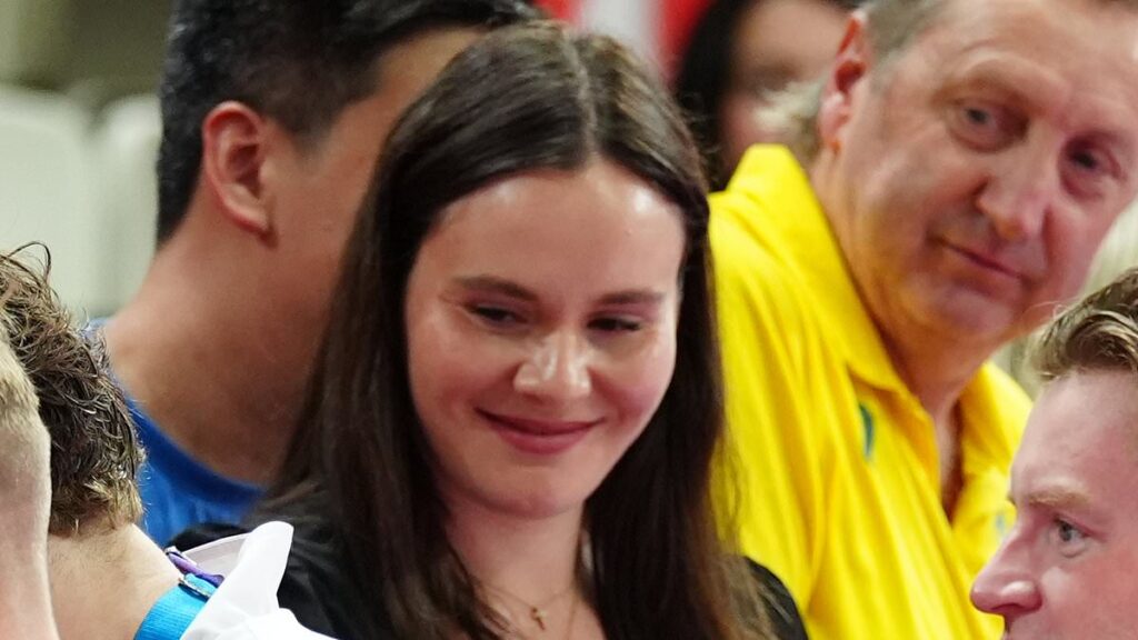 Adam Peaty kisses pregnant wife Holly Ramsay’s baby bump as he celebrates winning a silver medal for the 4x100m relay at the Commonwealth Games