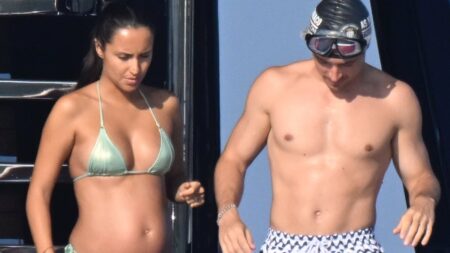 Charles Leclerc’s wife Alexandra shows off ‘baby bump’ in a green metallic bikini as she joins him on board his £15million luxury yacht off the coast of Sardinia