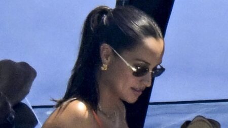 Charles Leclerc’s wife Alexandra shows off her ‘baby bump’ in a £477 citrus mini dress as she joins him and their miniature dachshund Leo on board £15million yacht in Sardinia