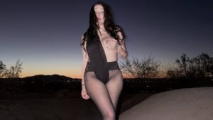 Miley Cyrus’ little sister Noah strips off thong bodysuit and bares her breast in bizarre desert photoshoot