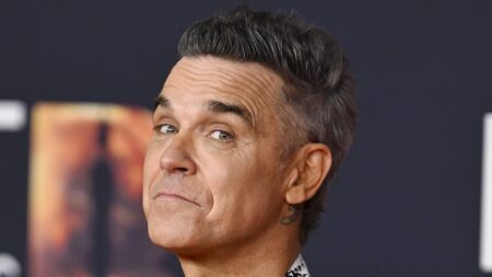 TALK OF THE TOWN: Robbie Williams hit by £12million loss over sale of Swiss estate he bought from golfing friend