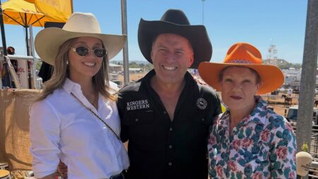 Karl Stefanovic divides fans as he poses with his wife Jasmine and Pauline Hanson at the Mount Isa Rodeo and calls them ‘the luckiest girls in the world’