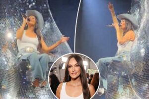 Kacey Musgraves sings atop giant ‘disco balls’ during cheeky tour performance