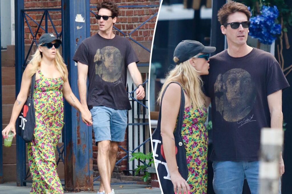 Busy Philipps holds hands with comedian Jason Selvig after revealing malignant brain tumor