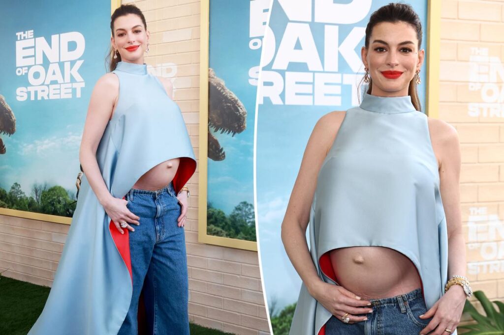 Pregnant Anne Hathaway bares baby bump in cropped cape at ‘The End of Oak Street’ premiere