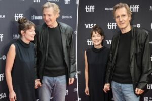 Liam Neeson, 74, holds hands with Stella Stocker on Toronto International Film Festival red carpet